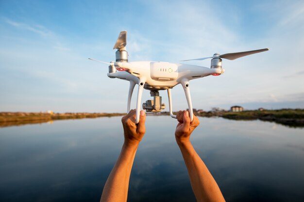 The drone and photographer woman hands