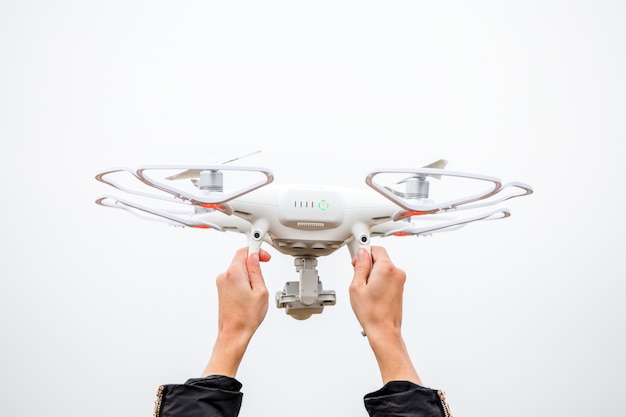 The drone and photographer woman hands