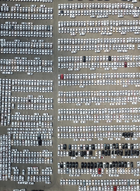 Drone point of view of cars parked at parking lot