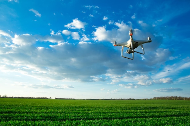 Drone quad copter on green corn field