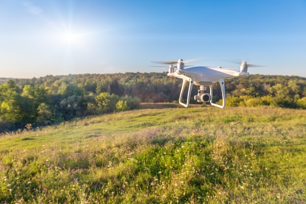 Drone quad copter on green corn field