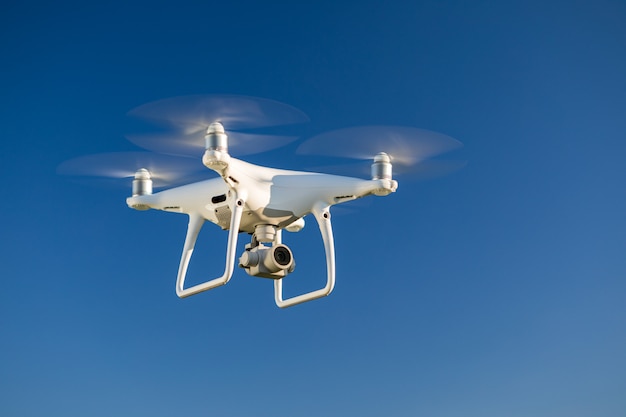 Drone quad copter on green corn field