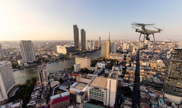 Drone quad copter with high resolution digital camera on the skyline and city background