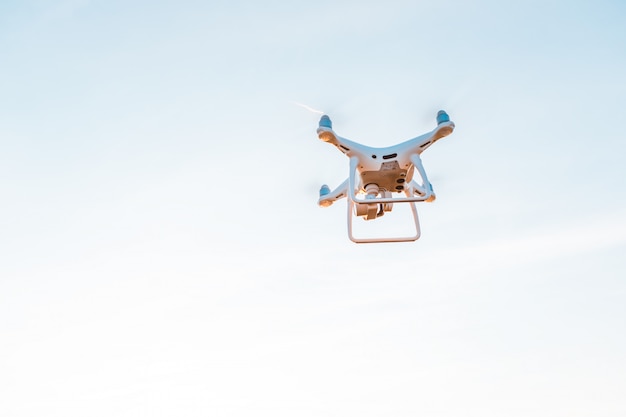 Drone quad copter on yellow corn field