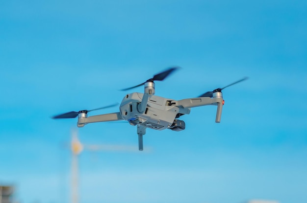 Drone quadcopter against a blue sky Air shooting aerial reconnaissance