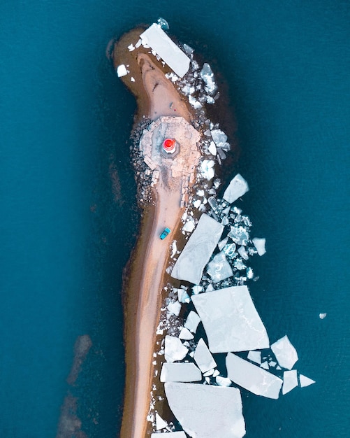 Drone view of lighthouse by sea