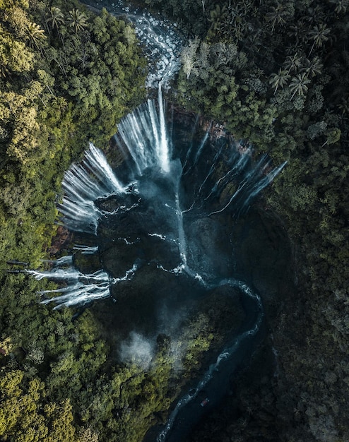 drone view of water flowing through mountains