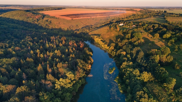 Drone with a camera, beautiful summer small river from a height