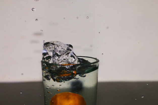 Drop drinking water glass with air bubbles.