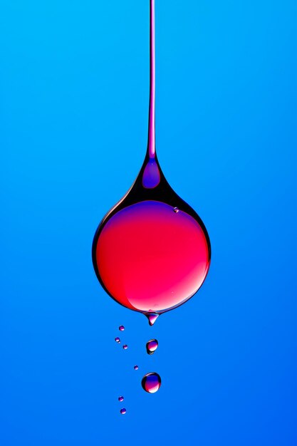 Drop of liquid is being dropped into blue sky generative ai