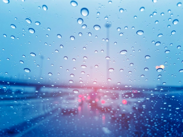 Droplet of water on car mirror traffic jam