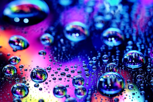 Droplets of water in a vivid colorful blurry background