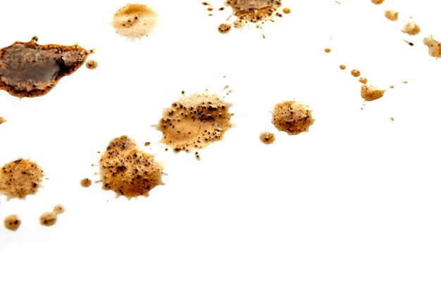 drops of black coffee on white background