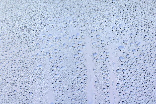 Drops glass blue background abstract, transparent cold\
background water splashes