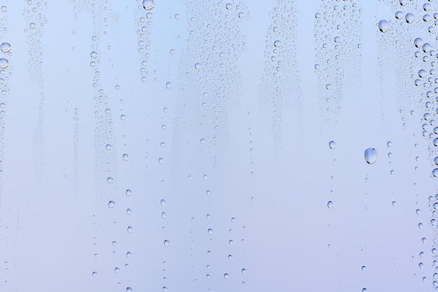 Фото Капли стекло синий фон абстрактные, прозрачный холодный фон брызги воды
