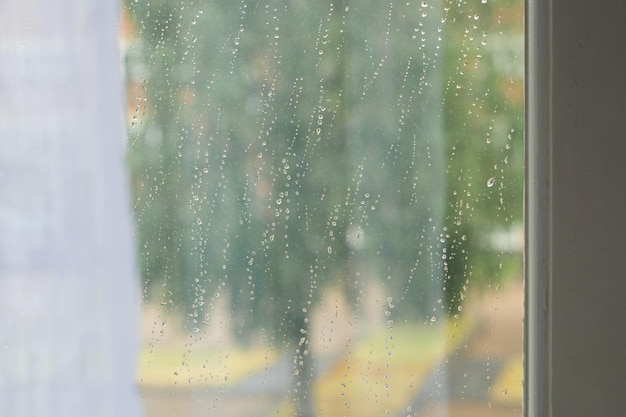 Drops of rain on the window wet weather