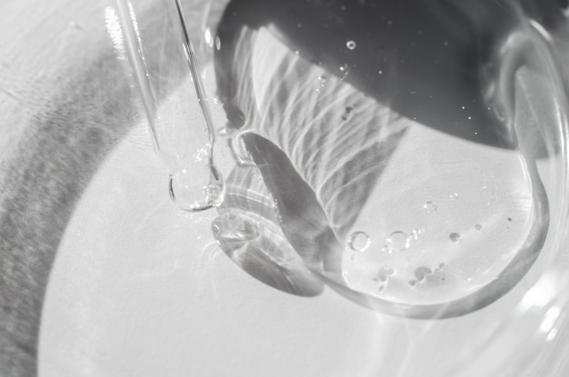 Drops of transparent gel in a Petri dish closeup