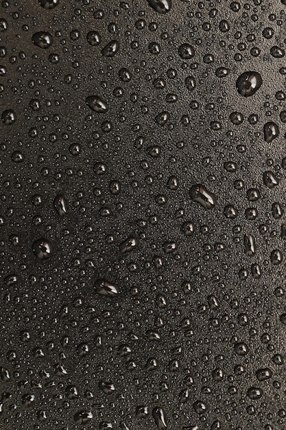 Drops of water on a black background. Macro photo texture drops.