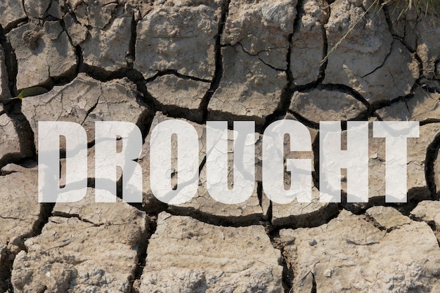 Photo drought big cracks in dry ground background poster