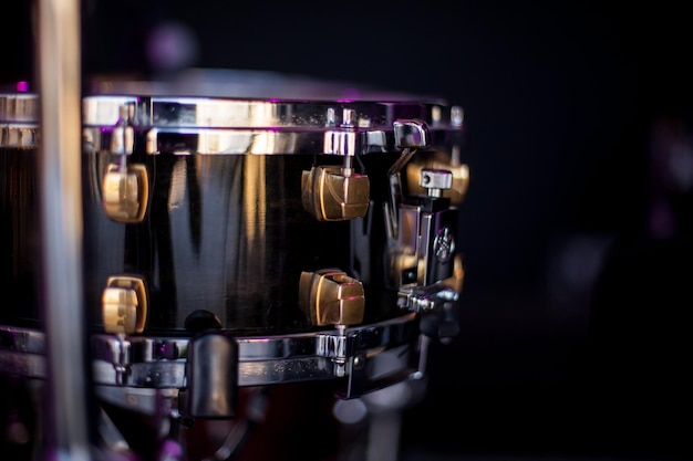 The drum kit detailed. A photo close up, selective focus. The drummer in action. A photo close up process play on a music. Drums, photo close-up.