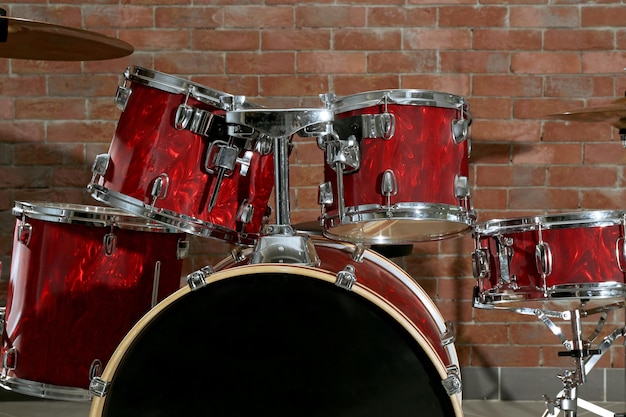 Drum set on brick wall background