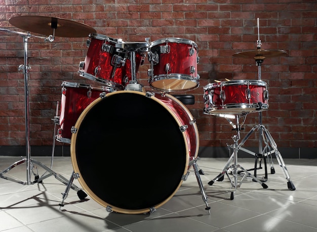 Drum set on brick wall background