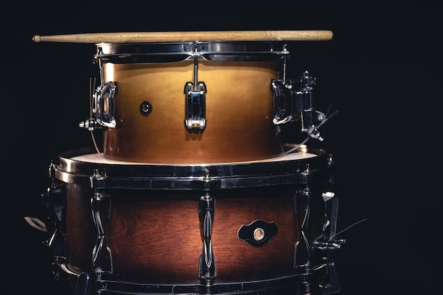 Drums on a dark background isolated percussion instruments