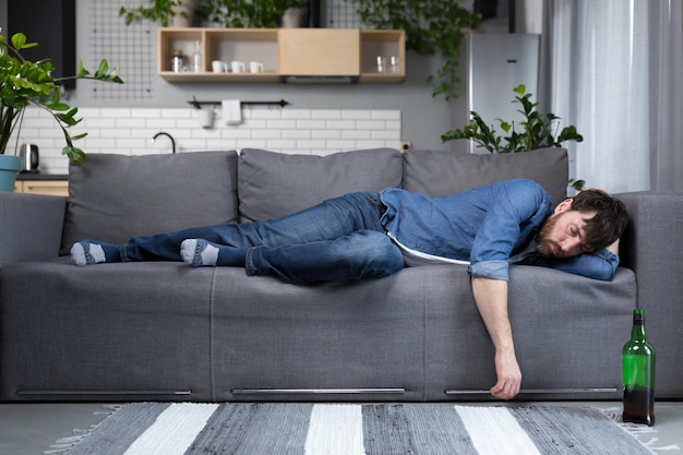 Premium Photo | Drunk man sleeping on the couch in the kitchen