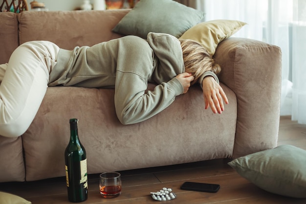 Drunk woman lying on a sofa