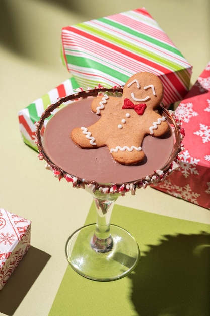 Drunken Gingerbread cookie man in a Christmas cocktail