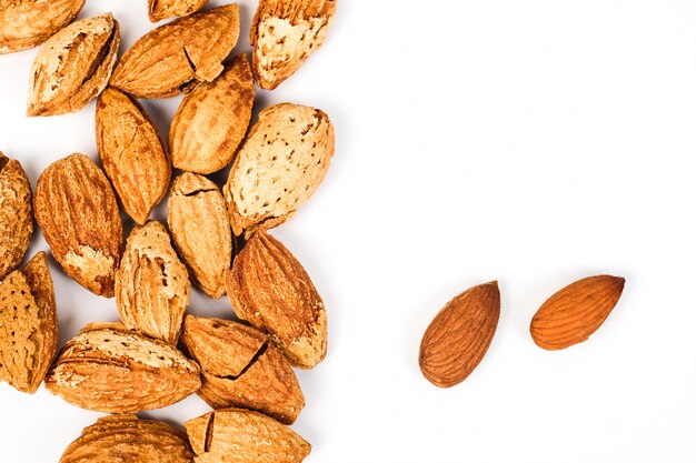 Dry Almonds nuts with shell on white background