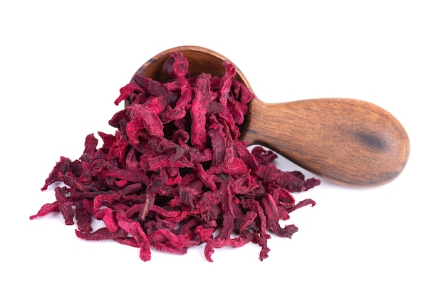 Dry beetroot in wooden spoon isolated on the white background Chopped dried beet