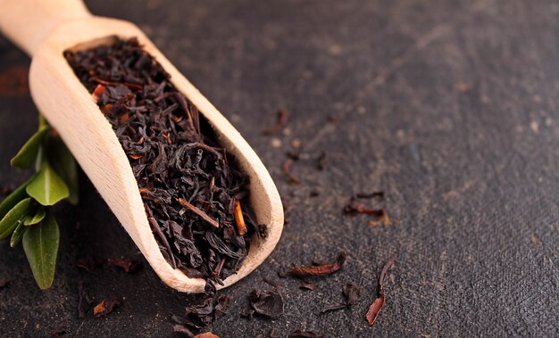 Dry black tea on a black background