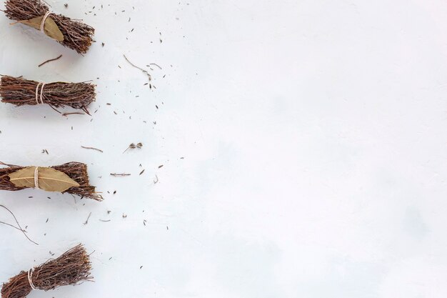 Dry bouquet garni on the white background, copyspace