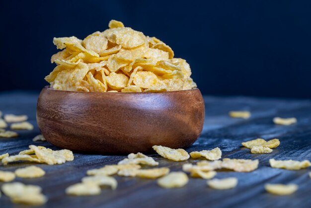 Dry breakfast corn flakes of yellow color close up