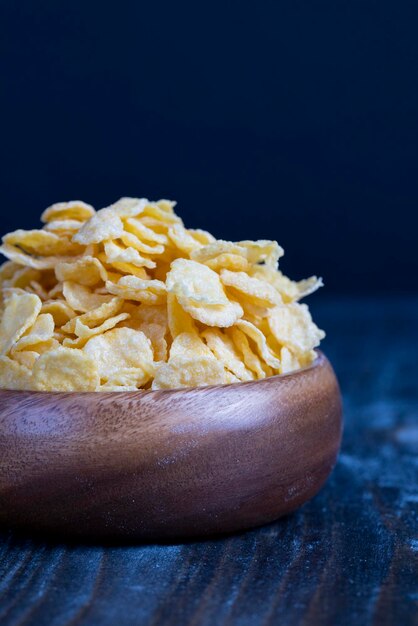 Dry breakfast corn flakes of yellow color close up