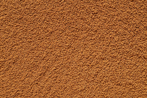 Dry brown instant coffee texture or background