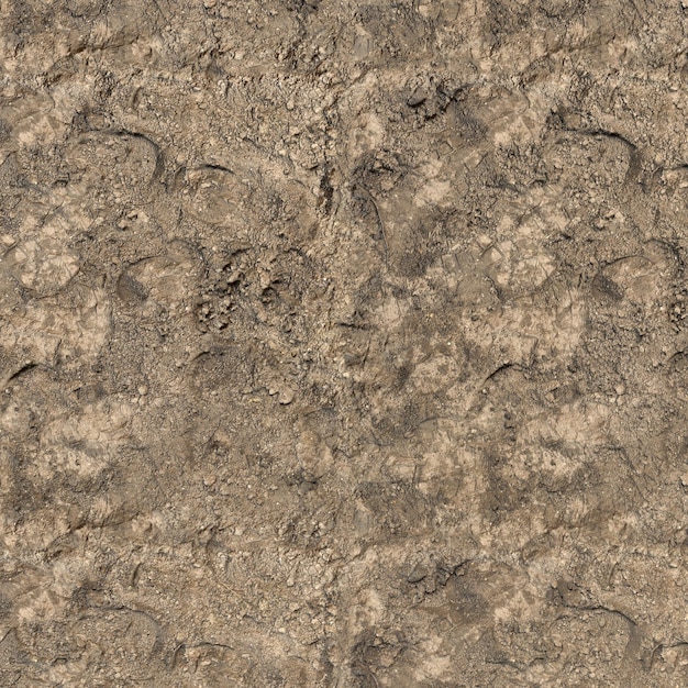 Photo dry brown mud background texture, close up and top view of brown mud with foot path on surface