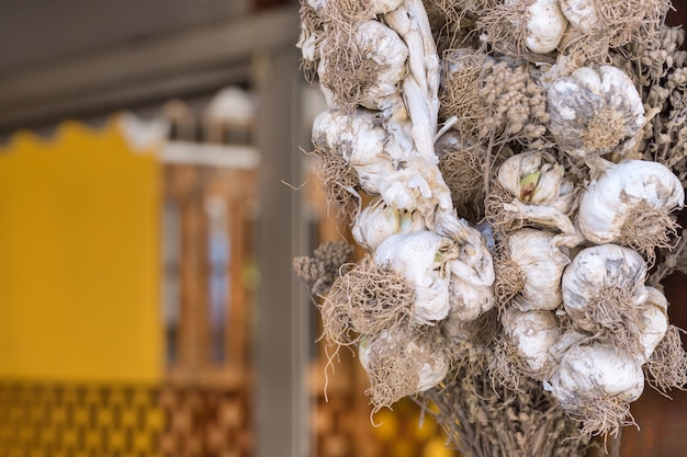 Dry bundles of garlic hanging on the terrace