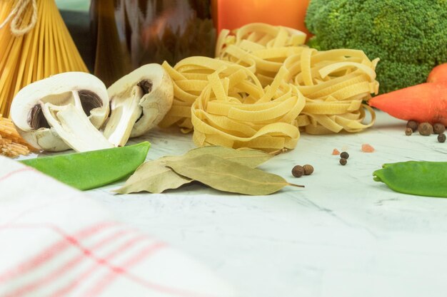 Dry and cheesy pasta with vegetables on the table