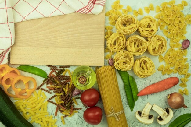 Dry and cheesy pasta with vegetables on the table