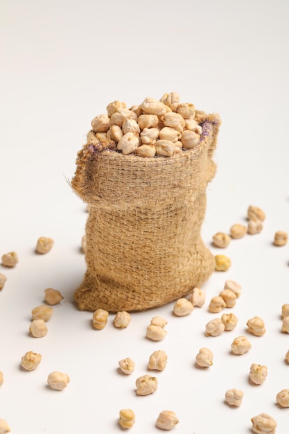 Dry chickpea in bag on white background.