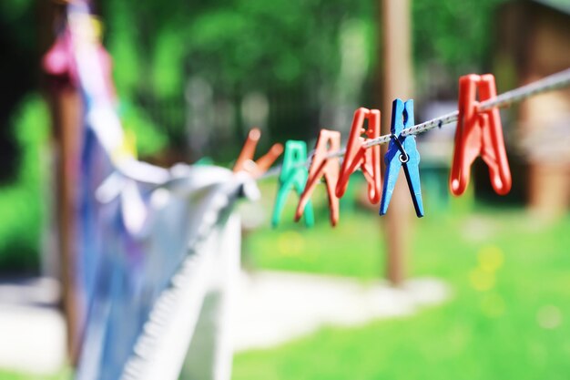 Photo dry clothes outside clothes on a rope clothespins on a clothesline in summer