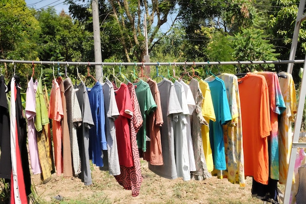 Photo dry clothes in various colors in the sun