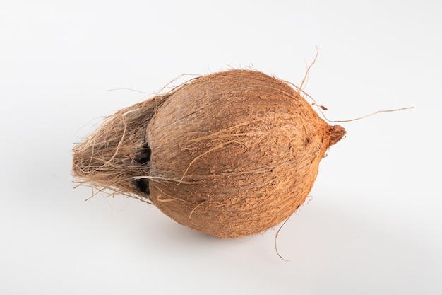 Dry coconut fruit isolated over white background