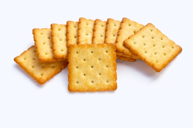 Dry cracker cookies on white background.