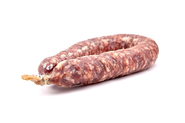 Dry cured pork sausage ring isolated on white background