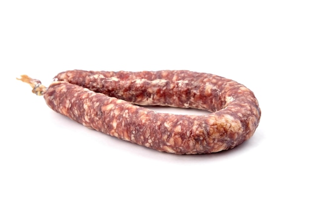 Dry cured pork sausage ring isolated on white background