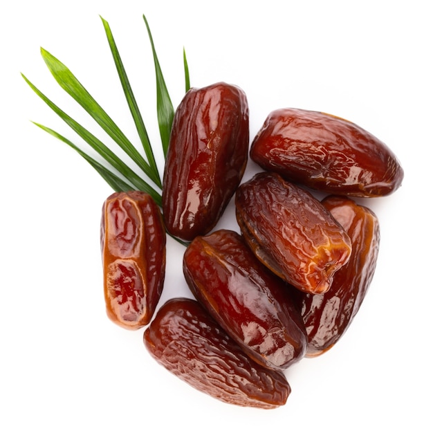 Dry dates isolated on white background. Top view. Flat lay pattern.