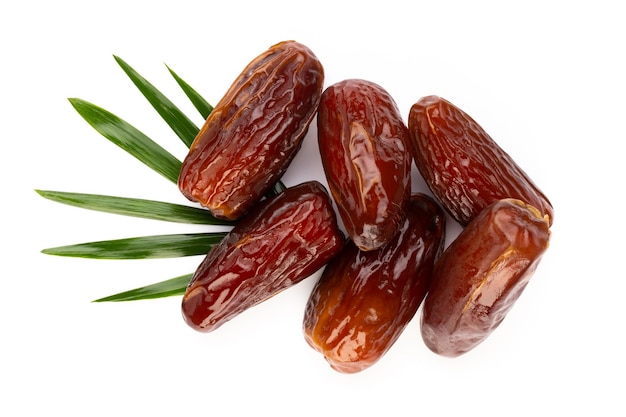 Dry dates isolated on white background. Top view. Flat lay pattern.